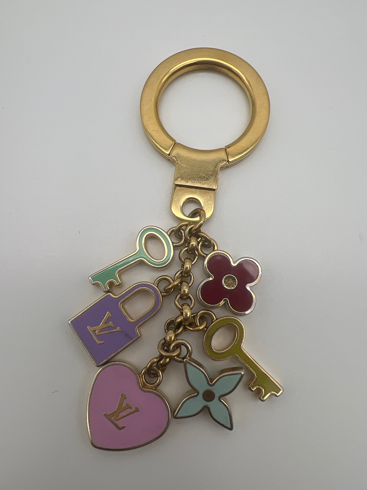 LOUIS VUITTON LOCK KEY AND FLOWER CHARM